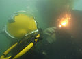 US Navy 110612-N-ZZ999-309 A Navy diver assigned to Mobile Diving and Salvage Unit (MDSU) 1 makes a cut on a sunken vessel at Kuantan Harbor during.jpg