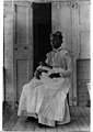 Woman with a child of upper class. St. Croix, the Danish West Indies (9468858651).jpg