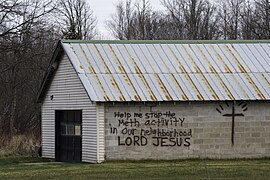 'Help me stop the Meth activity in our neighborhood Lord Jesus' printed on a garage in Palisade, Minnesota.jpg
