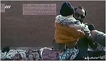 لاجوردی همراه با مصطفی رجوی بالای سر جنازه‌ی اشرف ربیعی، موسی خیابانی و همراهانشان ایستاده است.