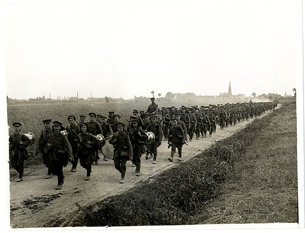 Men of the 8th (Service) Battalion, North Staffordshire Regiment (Prince of Wales's Own) on the march near Merville, France, 5 August 1915.