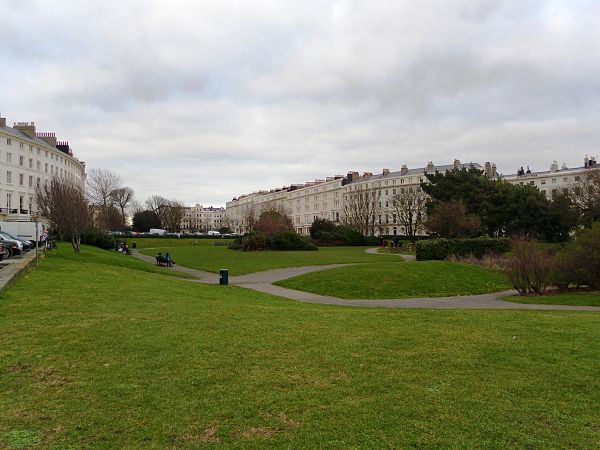 An "elegantly handled ... double curve" marks the transition from Adelaide Crescent (foreground) to Palmeira Square. The Enclosures belonging to the h