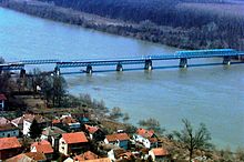 Brcko Bridge between Brcko and Gunja in 1996. Wartime damage was repaired in 2000. Aerial photo of Brcko Bridge in 1996.jpg