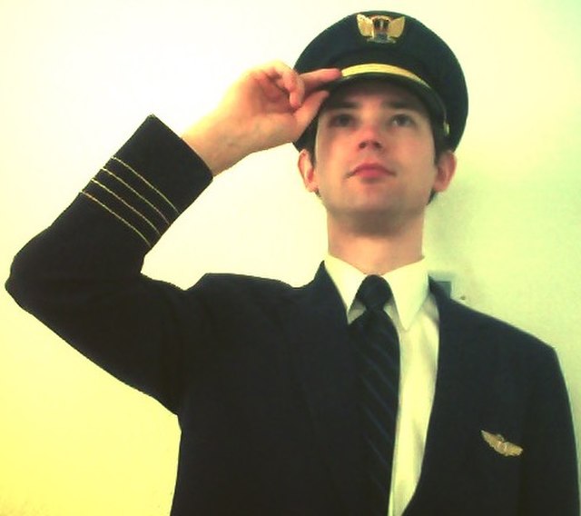 An airline pilot in uniform.