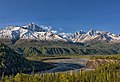 Amulet Peak (left) rising above Matanuska River, with parent Awesome Peak——to right of center