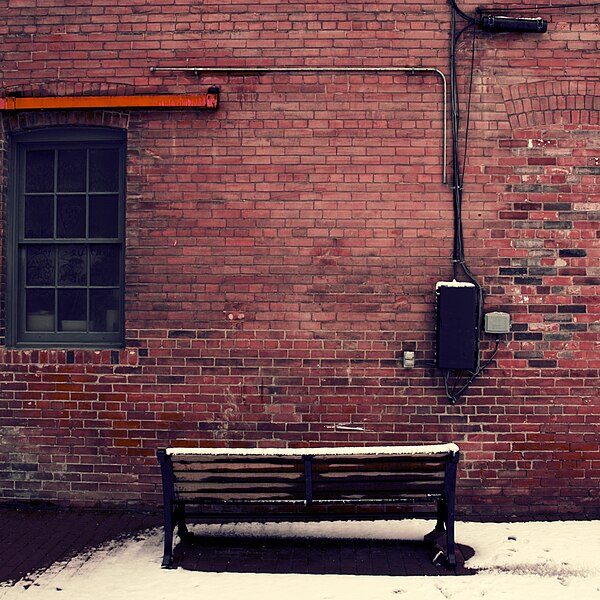 File:Bench, brick and snow. (10317272484).jpg