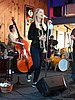 Bria Skonberg singing, holding a trumpet