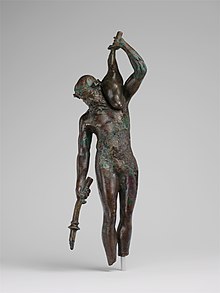 Bronze statuette of a satyr with a torch and wineskin MET DP118083.jpg