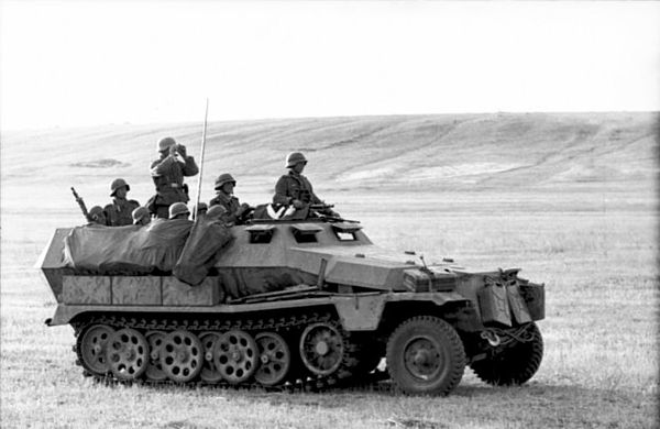 German Panzergrenadiers mounted on a Sd.Kfz. 251 armoured half-track.