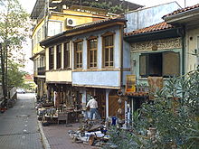 Small business in Bursa, Turkey. One of the claimed advantages of small business owners is the ability to serve market niches not served by mass production industries. Consider how few major corporations would be willing to deal with the risks and uncertainty that small antique store deals with buying and selling non-standardized items and making quick assessments of the value of rare items. BursaMercatiVerde.jpg