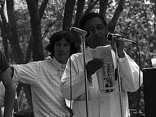 Mexican-American labor activist César Chávez (right) speaking to members of the United Farm Workers Union in California in 1974. Head of the union, Chávez was a leading voice for the rights of migrant farm workers, focusing national attention on their terrible working conditions.