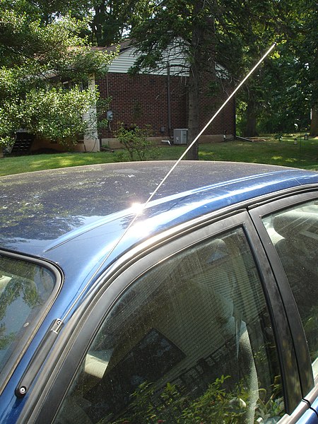 Whip antenna on car