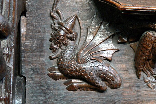 A carved wyvern on the choir stalls of Chester Cathedral in Cheshire, England, c. 1380