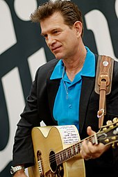 Chris Isaak held the top spot for four weeks with First Comes the Night. Chris Isaak at NAMM 1 25 2014 -15 (12243161146).jpg