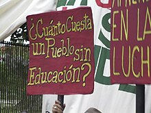 Cuánto Cuesta un Pueblo sin Educación protest sign in Puerto Rico.jpg