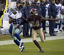 Bryant being covered by Josh Norman in a game against the Washington Redskins Dez Bryant, Josh Norman (37996771602).jpg