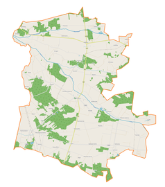 Mapa konturowa gminy Drużbice, w centrum znajduje się punkt z opisem „Parafia św. Rocha”