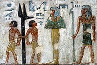 Illustration for the Book of Gates, 6th gate -- scene from the tomb (KV11) of Pharaoh Ramesses III (c. 1186-1155 BC). Enemies bound to jackal-headed pillar (KV11).jpg