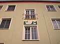 Window grilles and murals on an apartment building in a residential complex