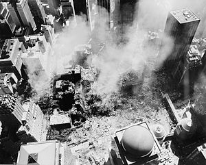 Looking down on ground zero area toward the east with smoke rising from the collapsed buildings