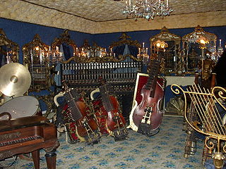 Automated musical instruments, operated by inserting tokens. Some instruments play, while others are synthesized.