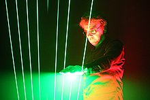 Jean Michel Jarre, a space music artist, performing with a laser harp Jarre playing laserharp.jpg