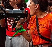 Barzola speaking at a reproductive justice rally in Boston in 2022. Kim Barzola Abortion Rally.jpg