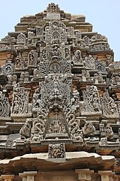 Kirtimukha relief sculpture on tiered superstructure over shrine in the Bhimeshvara temple at Nilagunda Kirtimukha relief sculpture on tiered superstructure over shrine in the Bhimeshvara temple at Nilagunda.JPG