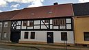 Residential house with two courtyard buildings and courtyard paving