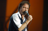 Restless Heart lead singer Larry Stewart, singing into a microphone