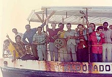 A boat crowded with Cuban refugees arrives in Key West, Florida, during the 1980 Mariel Boatlift. Mariel Refugees.jpg