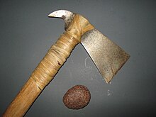 A meteorite and a hatchet that was forged from meteoric iron Meteorite and a meteoritic iron hatchet.JPG