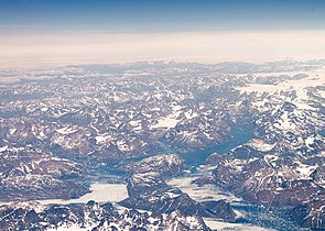 Mountains in southern Greenland, as seen from an altitude of approximately 34,000 feet
