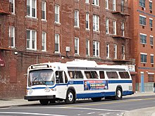A museum bus on the B65 route lays over at the eastern terminus in Ocean Hill. NYC Transit Authority GMC Blitz T6H-5305A 5227.jpg