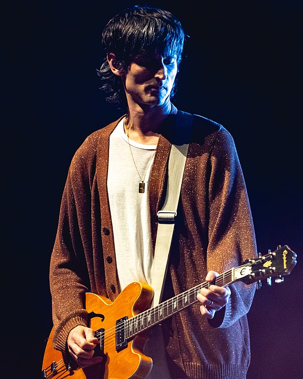 Valensi performing with the Strokes on New Year's Eve 2019