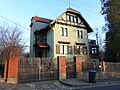 Villa with gate entrance, retaining wall and enclosure