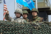 A U.S. Army officer confers with South Korean soldiers at Observation Post (OP) Ouellette, viewing northward, in April 2008 ObservationPostOuellette.jpg