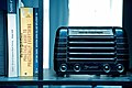 Old Dusty Radio on a shelve with books on the left.jpg