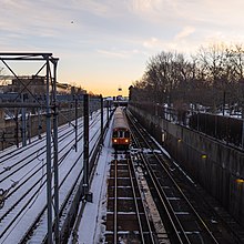 Orange Line train in the Southwest Corridor in Jamaica Plain, MA.