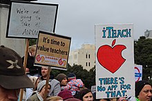 Placards at NZEI Te Riu Roa strike rally on the steps of parliament 15 August 2018. The placards read "We're not going to take it ANYMORE", "It's time to value teachers" and "iTeach, there's no app for that". Placards at NZEI Te Riu Roa stike rally on the steps of parliament 15th August 2018.jpg