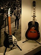 Rickenbacker 325 (c.1964, black, white pickguard), Epiphone EJ-160E (sunburst) - Exposition John Lennon unfinished music - Musée de la musique (2006-04-30 15.36.29 Benoit Darcy).jpg
