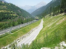 Rockfall protection embankment surmounted by a rockfall barrier (Gotthard Pass, Switzerland) RockfallembankmentGotthardPass.jpg