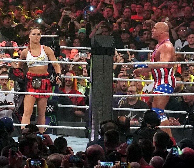 Rousey at WrestleMania 34 with Kurt Angle (also her WWE debut match)