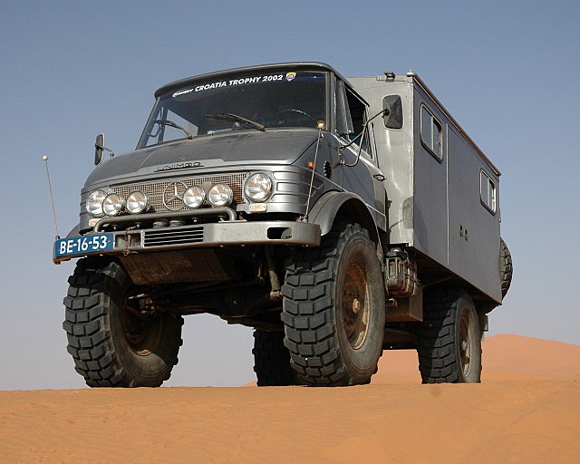Mercedes-Benz Unimog in the Dunes of Erg Chebbi in Morocco. The vehicle's portal gear axles provide high ground clearance.