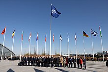 Project 2025 would pressure NATO member states to increase their military spending in order to confront the Russian threat. Secretary Blinken Participates in a Flag Raising Ceremony for Finland at NATO Headquarters (52807659247).jpg