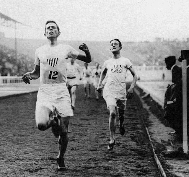 Sheppard narrowly defeating Harold A. Wilson in the 1500 metres race in the 1908 Olympic Games