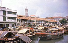 Singapore thrived as an entrepot. In the 1960s, bumboats were used to transport cargoes and supplies between nearshore ships and Singapore River. SingaporeRiver-bumboats-196009.jpg