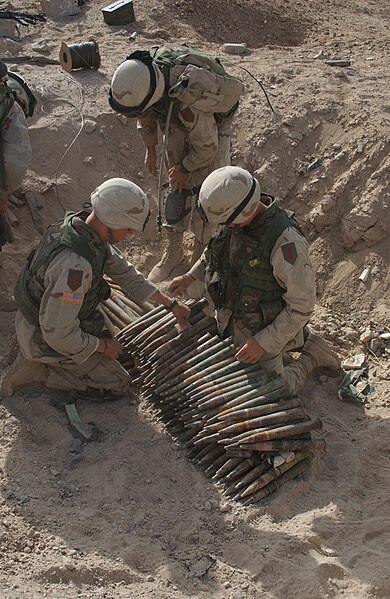 File:Soldiers from 9th Engineer Battalion, place C-4 explosives onto 37mm anti-aircraft rounds to be destroyed near the city of Bayji, June 20, 2004.jpg