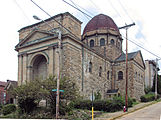 Former St. Francis de Sales church in McKees Rocks, Pennsylvania. The building was closed in 1993 and sold, but appears to be abandoned at the time of this picture.