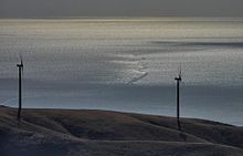 Some of the turbines at Starfish Hill wind farm; Gulf St Vincent in background